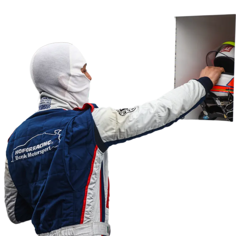 Gabriele Piana grabbing his helmet, getting ready for a racing stint.